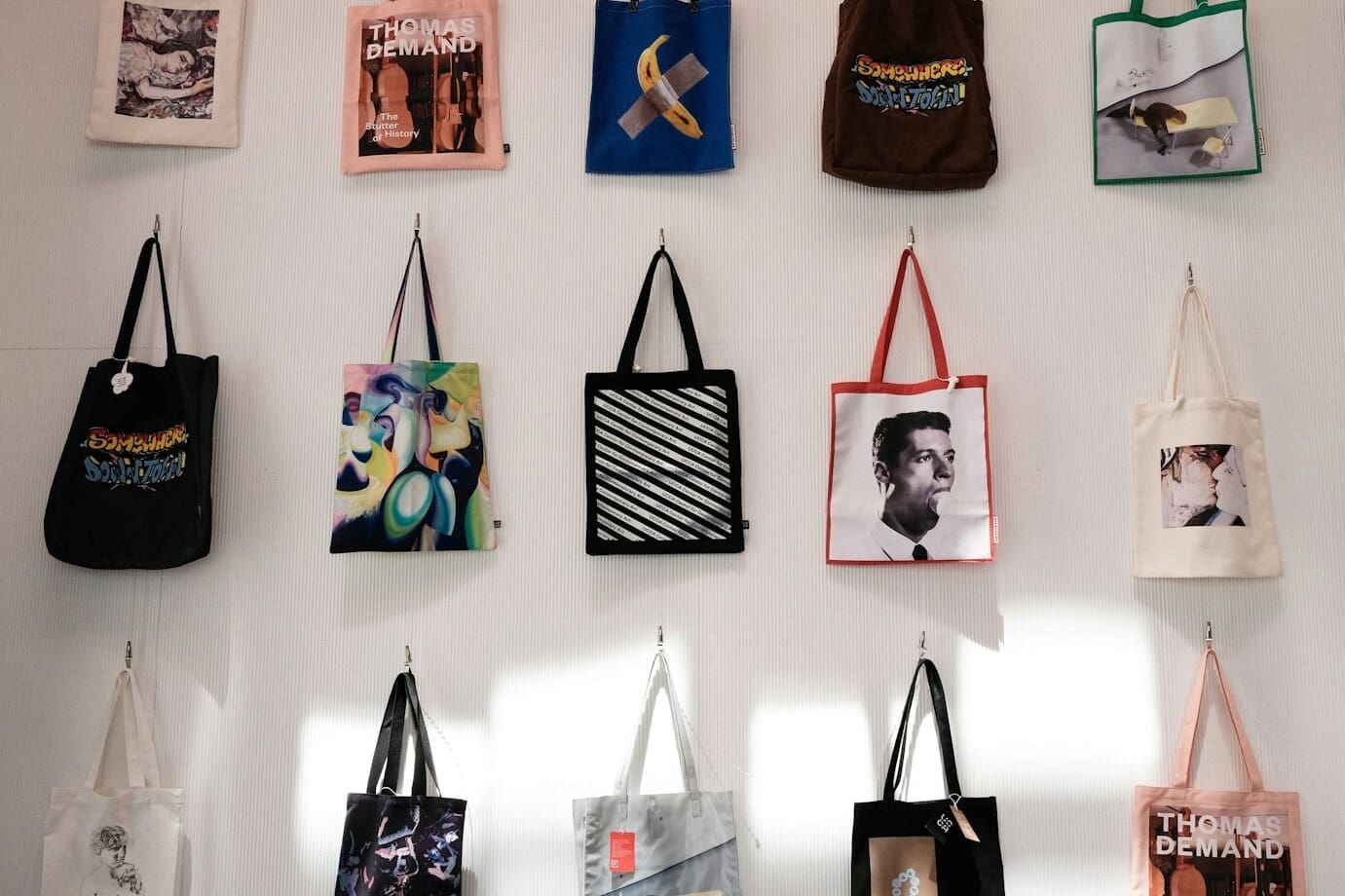 a bunch of bags hanging on a wall